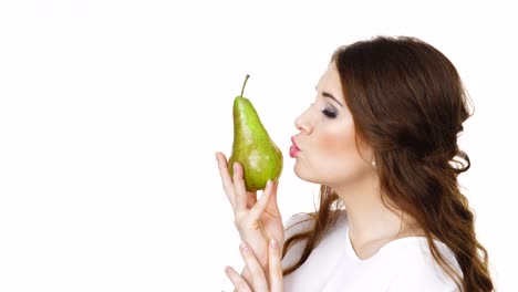 Charming-woman-holds-pear-fruit,-isolated