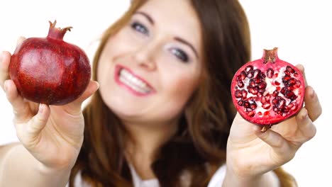 Woman-offering-pomegranate-fruit-on-white