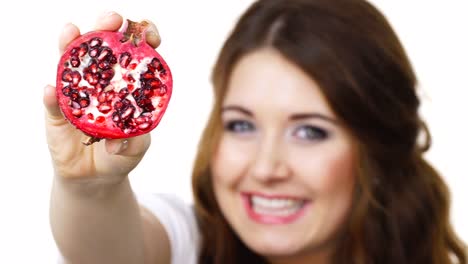 Woman-offering-pomegranate-fruit-on-white