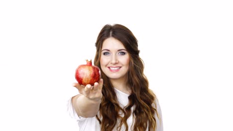 Woman-offering-pomegranate-fruit-on-white