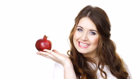 Cheerful-woman-holds-pomegranate-fruit,-isolated