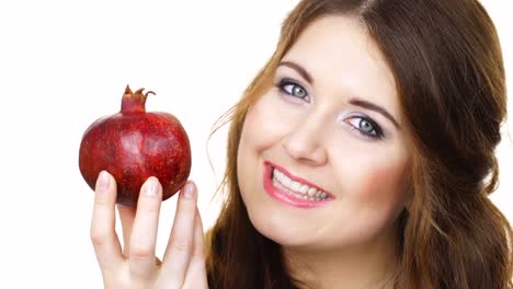 Cheerful-woman-holds-pomegranate-fruit,-isolated