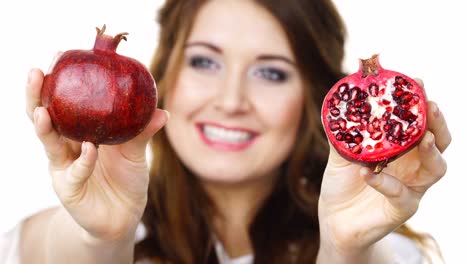 Woman-offering-pomegranate-fruit-on-white