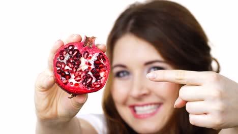 Woman-offering-pomegranate-fruit-on-white