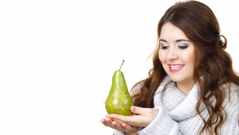 Woman-holds-pear-fruit,-licking-lips-isolated