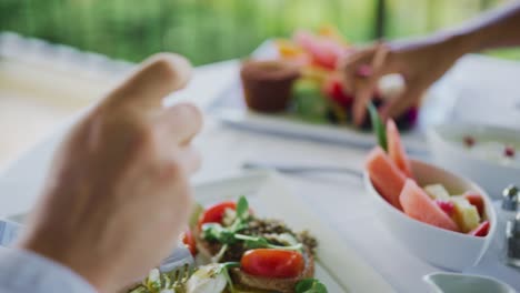 Couple-Enjoying-Breakfast-at-Resort