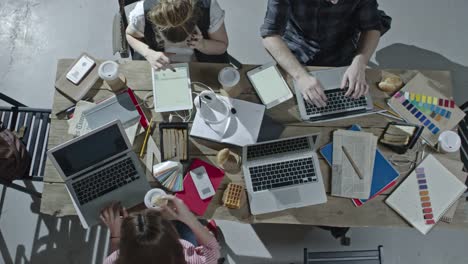 Design-Team-Working-at-Table