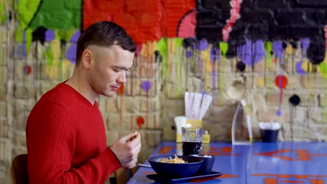 Waiter-brings-order-to-a-guest-in-Korean-restaurant