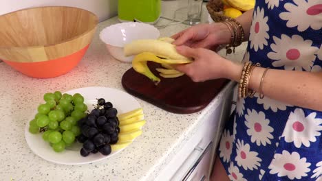 Woman-removes-banana-peel