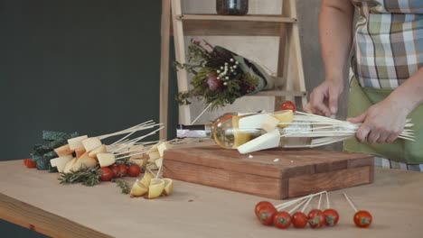 Woman-making-edible-bouquet-arrangement