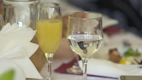 Close-up-of-dining-table-with-served-appetizers-and-beverages