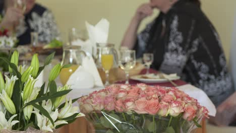 Close-up-of-festive-dinner-table-with-served-appetizers-and-beverages