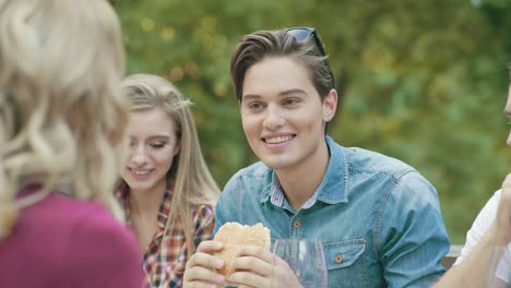 Happy-Friends-In-Outdoor-Picnic-Party-Having-Fun