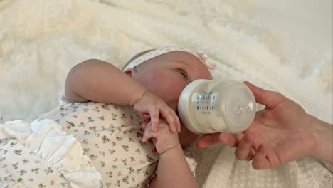 Little-baby-drinking-milk-from-bottle