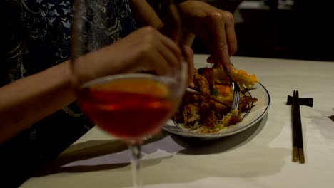 Women's-hands-cut-crab-meat-into-batter-with-a-knife-and-fork