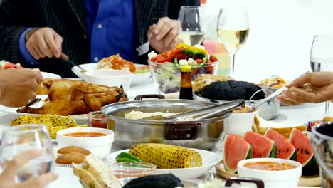 Group-of-friends-enjoying-dinner-on-New-Year's-party.