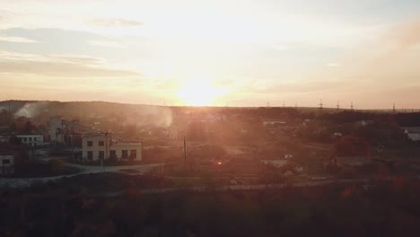 view-of-the-suburban-infrastructure-which-covered-with-smoke-after-a-fire-from-a-drought-at-sunset-on-a-warm-summer-evening.