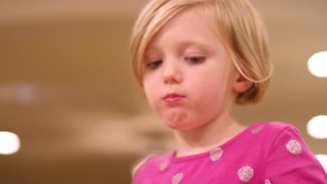 Close-up,-young-girl-eating-ice-cream,-slow-motion