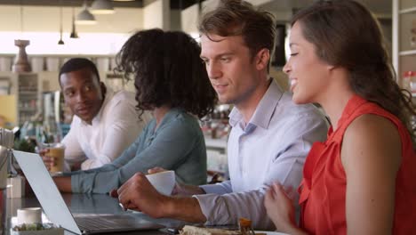 Couple-Using-Laptop-During-Lunch-In-Cafe-Shot-On-R3D