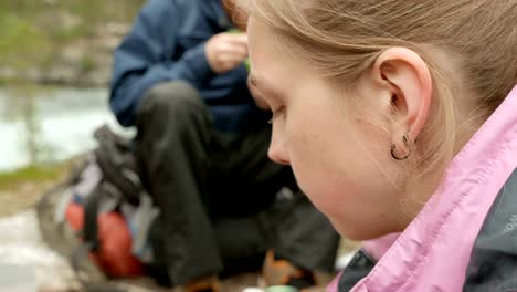 Girl-eats-bread-and-butter-outdoors