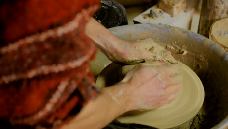 9-shots.-Professional-male-potter-working-in-workshop