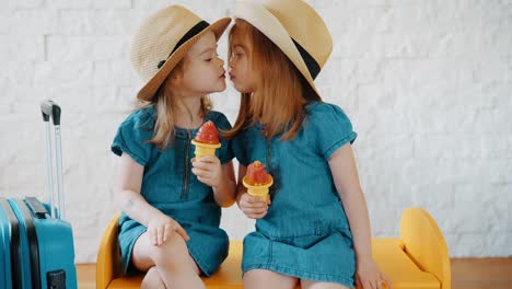 little-girls-give-themselves-kisses-and-wait-for-summer