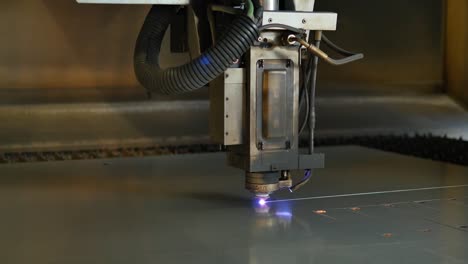 Laser-cut-machine-while-cutting-the-sheet-metal-with-sparks-and-high-precision