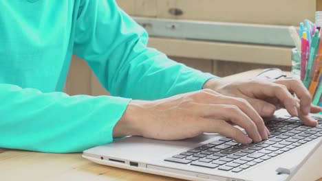 Green-Long-Sleeve-T-Shirt-Businessman-Typing-Laptop-in-Home-Office.-Communication-by-Internet