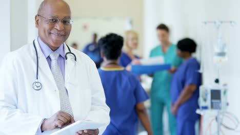 Portrait-of-African-American-male-doctor-using-tablet