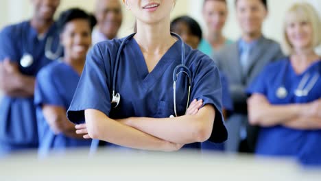 Portrait-of-Asian-American-female-nurse-and-team