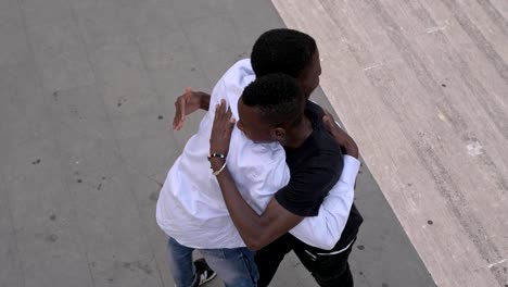 Brotherhood,friendship.-Two-young-american-african-men-hugging-in-the-street