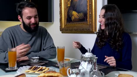 Young-smiling-couple-has-breakfast--slow-motion