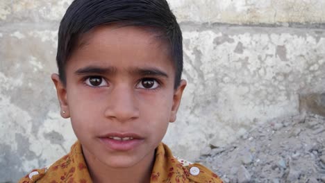 Cute-Indian-boy-looking-at-the-camera,-closeup