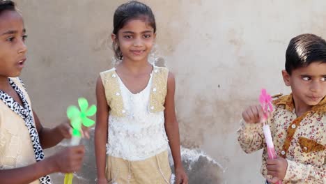 Indian-children-blowing-bubbles-and-playing-with-friends