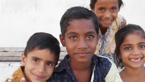 Kids-play,-having-fun-and-sticking-their-tongues-out-for-a-photo,-India