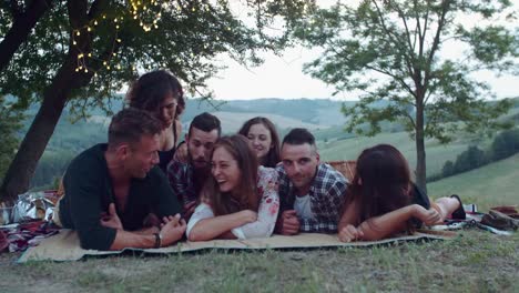 group-of-friends-making-faces-during-the-pic-nic.-shot-in-slow-motion