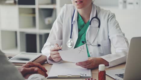 Doctor-giving-prescription-to-patient