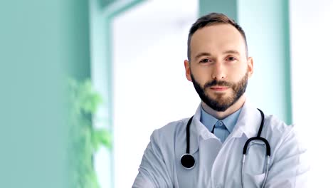 Close-up-portrait-confident-male-chief-medical-officer-with-beard-and-white-lab-coat