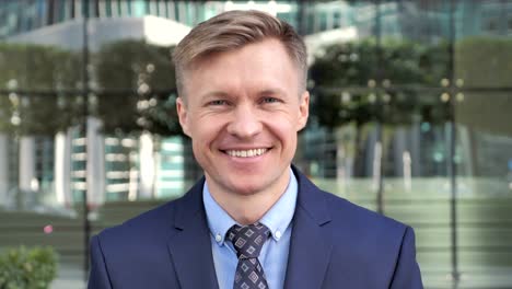 Smiling-Businessman-Outside-Office