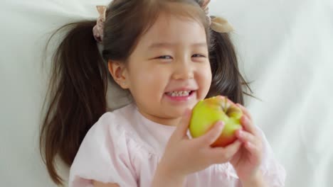 Cute-Asian-Girl-Eating-Apple