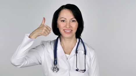 Portrait-of-Lady-Doctor-Gesturing-Thumbs-Up