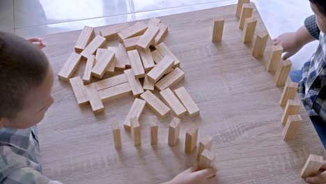 Asian-children-boy-playing-with-wooden-blocks-game-at-home.