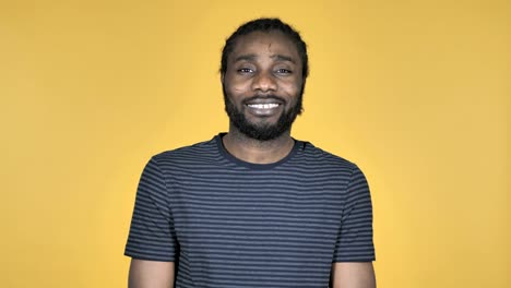 Smiling-Casual-African-Man-Isolated-on-Yellow-Background