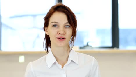 Smiling-Woman-in-Office