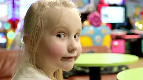 Close-up-sad-face-of-a-little-girl-is-in-the-children's-center.