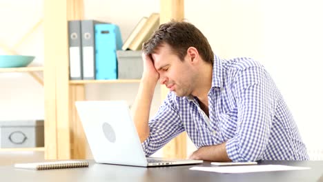 Tired-Sleeping-Man-on-Desk-in-Office