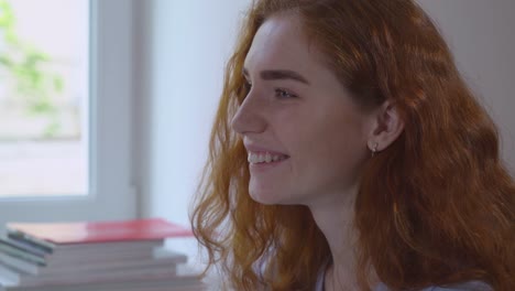 Profile-view-redhead-girl-with-smile.