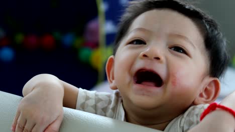 cute-baby-boy-happy-in-fluffy-mattress-partition-in-limit-area-self-protection