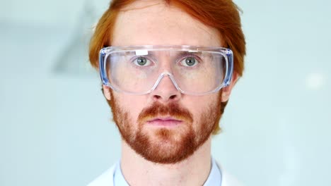 Close-Up-of-Redhead-Reseach-Scientist,-Doctor-Wearing-Protective-Glasses