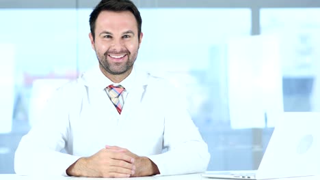 Thumbs-Up-by-Doctor-Sitting-in-Clinic